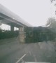 Truck Topples Over After Colliding With Barrier