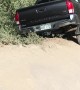 Car Hangs Precariously off Mountain Trail