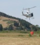 Series of Helicopters Fill Buckets to Fight Bridger Foothills Fire