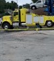 Towing Company Owners Use Crane and Car for Gender Reveal