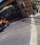 Rider Wheelies into Metal Fencing by Restaurant