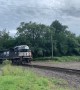 Happy Train Engineer Throws Gift to Railfan