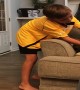 Playful Raccoon Leaps from Couch to Kid