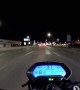 Swerving Car Zooms Past Motorcyclist