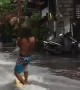 Surfer Enjoys the Rainy Season