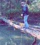 Walking Over a Fallen Tree to Cross the River