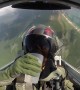 Fighter jet pilot easily drinks water from cup while flying upside down
