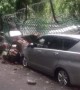 School Walls Crippled by Heavy Rains Crush Parked Cars