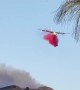 Plane drops fire retardant over Chino Hills State Spark in California