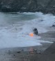 Large Waves Swallow SUV Stuck on Beach