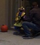 Young Girl Trick or Treating Takes a Tumble