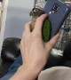Parrot Seeking Attention Wiggles Between Phone and Hand