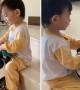 Toddler takes great care cleaning toy car