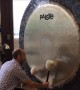 Gong Master Creates Eerie Music on Giant Gong