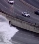 Guy on bike gets pummeled by Lake Michigan waves