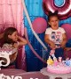 Sisters Fighting to Blow Out the Birthday Candle