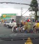 Truck Stops on Top of Motorcycle in Busy Intersection
