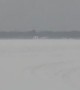 Wind Blows Ice Fishing Shanty Across Lake