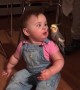 Little Girl Plays with Bird Buddy
