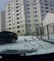 Quick Thinking Driver Reverses Away from Sliding Car