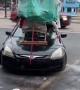 Car Carries Large Load on Rooftop