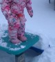 Toddler Face Plants into Snow off Picnic Table