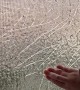 Breaking up Ice on Frozen Window Screen