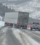 Semi Fishtailing Trying to Pass Vehicles on Icy Roads