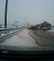 Jackknifing Truck Slides Through Traffic on Icy Road