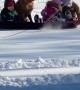 Dog Joins Family for Sledding Fun