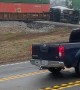Stranded Truck Sliced in Two by Train