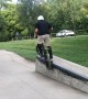 Kid Practicing BMX Goes Over the Handlebars