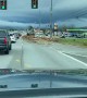 Logging truck spills load all over highway, causes massive damage