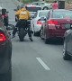 Angry Motorcyclist Kicks Swerving Car