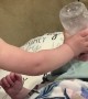 Big Sister Sends Bottle at Baby