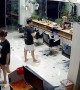 Guy and Gal Tumble over Barbershop Cabinet