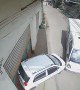 Runaway Truck Pushes Parked Car Into Building