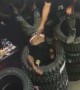 Man Accidentally Gets Head Stuck in Tire Stack
