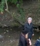 Slippery Embankment Leads to Tumble into the Water
