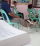 Guy in Church Swings Puppy with His Feet