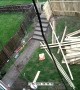 Guy Tearing Down Fence Takes a Tumble