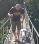Dad Helps Dog Hesitant to Cross Bridge