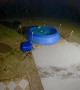 Bear Removes Pool Cover to Take a Late Night Swim