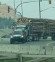 Loaded Logging Truck Towed By Powerful Pickup Truck