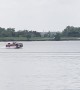Pickup Truck Vessel Cruises Across Lake