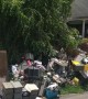 House Blocked by Mountain of Junk