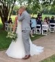 Newlywed couple falls after attempting a romantic kiss  