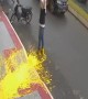Dropping a paint bucket on the sidewalk