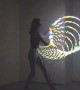 Talented girl performs incredible tricks with LED hula hoop 