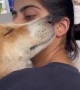 Woman receives the most precious hug from her doggy